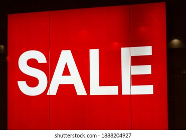  sign in  shopping center with  inscription "Sale". Red canvas with white letters in  store. - Shutterstock ID 1888204927
