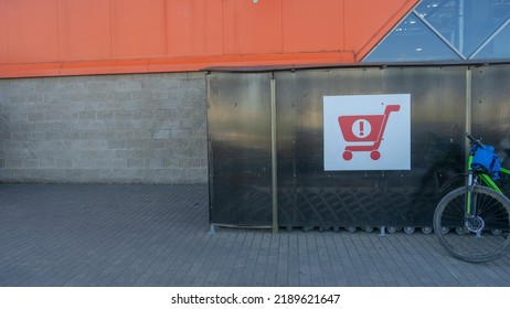 Sign Of Shopping Trolleys Parking Lot. Shopping Carts Return Point On A Parking Lot Near Supermarket. Shopping Cart Icon. Shopping Offline Concepts.