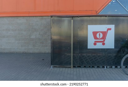 Sign Of Shopping Trolleys Parking Lot. Shopping Carts Return Point On A Parking Lot Near Supermarket. Shopping Cart Icon. Shopping Offline Concepts.