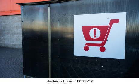 Sign Of Shopping Trolleys Parking Lot. Shopping Carts Return Point On A Parking Lot Near Supermarket. Shopping Cart Icon. Shopping Offline Concepts.