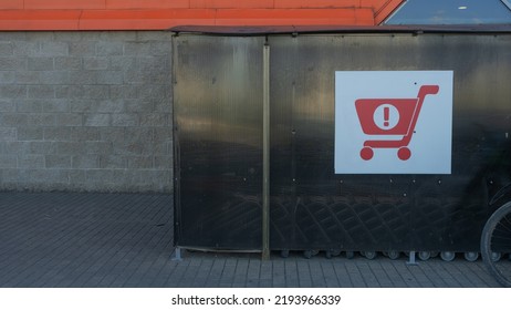 Sign Of Shopping Trolleys Parking Lot. Shopping Carts Return Point On A Parking Lot Near Supermarket. Shopping Cart Icon. Shopping Offline Concepts.