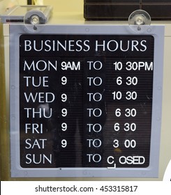 Sign Showing Business Opening Hours