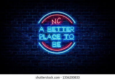 A sign showing North Carolina state slogan, in blue and red neon light on a brick wall background and wires on the side. - Shutterstock ID 1336200833