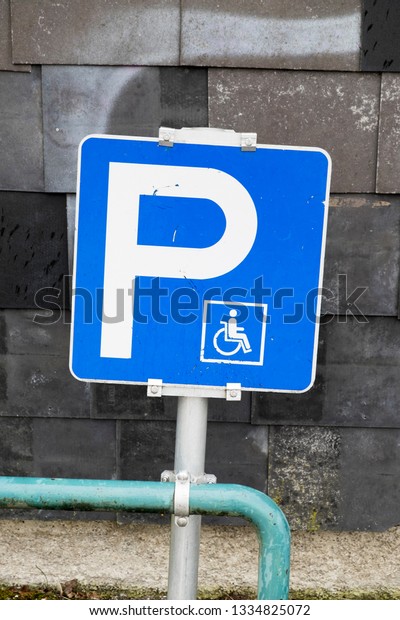a\
sign showing the parking lot is reserved for\
disabled
