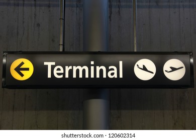 Sign Showing The Way To The Airport Terminal Building