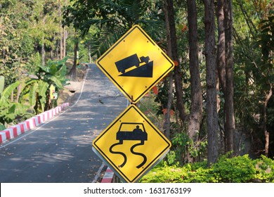 Sign Of Slippery Road And Slope Road