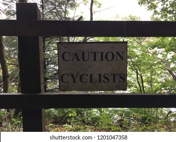Sign stating "Caution Cyclists" highlighting a warning to drivers of cyclists on the road and road safety