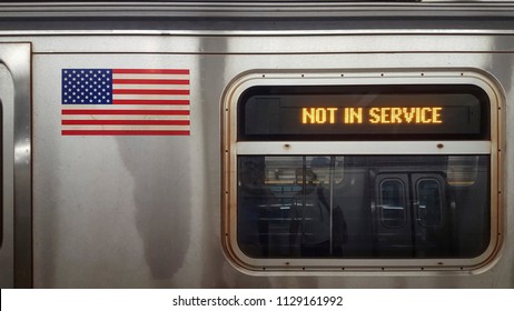 Sign Stating Not In Service On NYC Subway Car With Window And American Flag