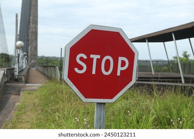 sign stop on the border between Brazil and French Guiana