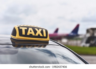 Sign Of Taxi Car On Background Airport With Airplanes