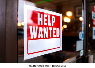Sign text closeup for help wanted with red and white colors by entrance to store shop business building during corona virus covid 19 pandemic - Shutterstock ID 1840085851
