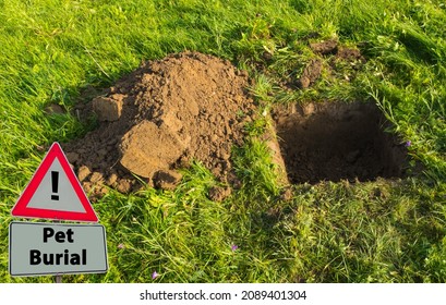 Sign With Text Pet Burial In Front Of Hole In Ground