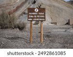 Sign that says; Do not enter, Danger zone, Abandoned mine.