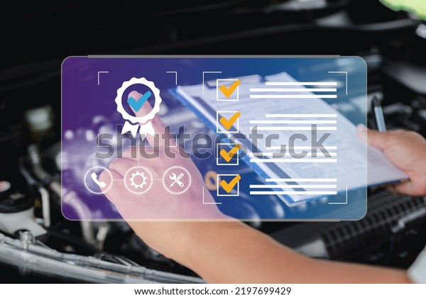Sign of the top service quality assurance in\
car service concept, car service staff check the quality of service\
on smart checklist guarantees customer satisfaction in taking the\
car for maintenance