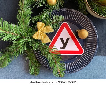 A Sign Of A Training Ride On A Beautiful Christmas Plate Next To A Fir Branch And A Bow