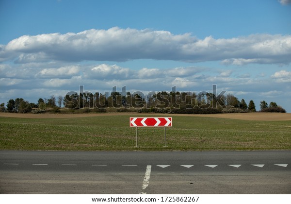 Sign turn\
left and right on the highway in the\
field