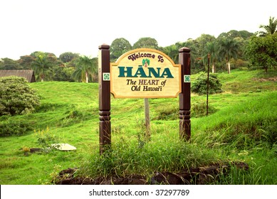 Sign welcoming visitors to the historic town of Hana following a winding scenic drive along Maui's coast.
