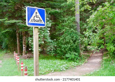 Sign For Wheel Chair Accessible Passage In The Forest Of Pyrenees Mountains Near Bielsa Town, Huesca Community, Spain. Park Access For Disabled People.