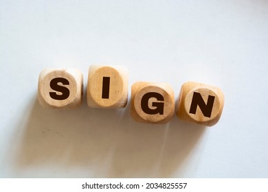 Sign Word Written In Wooden Cubes On An Isolated Light Table. Singing, Karaoke Or Vocal Training Concept.