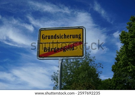Sign with the words Citizen's Allowance and Basic Security in German words