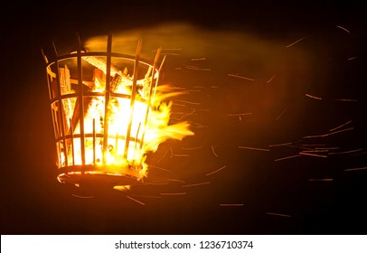 A Signal Beacon On Fire With Smoke And Sparks. 