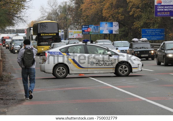 Signal\
lights of a special patrol car on the road near the roadblock in\
front of the city of Kiev, Ukraine,\
05.11.207