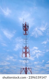 Signal tower or Mobile phone tower with dayligth sky. Telecommunication tower with 5G cellular network antenna. Global connection and internet network concept. - Shutterstock ID 2396159147