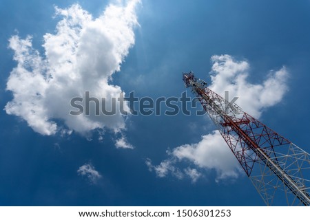 Signal tower or Mobile phone tower with dayligth sky and white cloud. Telecommunication tower Antenna.Modern communication concept by using 5 g internet
