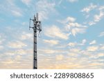 Signal tower or Mobile phone tower .Glbal connection and internet network concept.on blue sky.