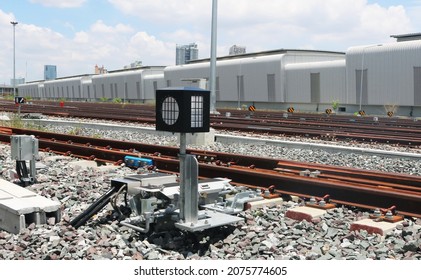 Signalling Light With Point Machine Installed On The Railway Ballast Track.