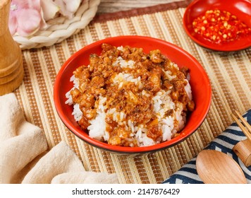 Signature Braised Pork Rice In A Bowl With Spoon And Chopsticks Isolated On Mat Side View On Wooden Table Taiwan Food