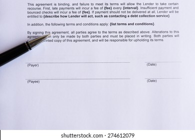 Signature Page For Payee And Payer  On The White Paper With Pen