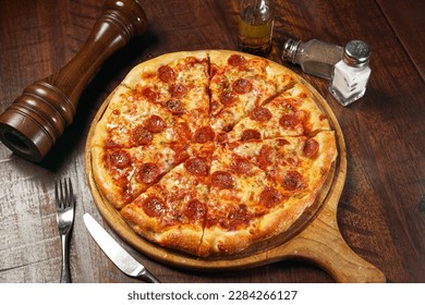 Signature Pepperonis Special Pizza isolated on cutting board top view on table italian fastfood - Powered by Shutterstock