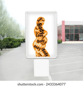 Signboard with orange silhouette of plus-size model with words Body Love on city street - Powered by Shutterstock