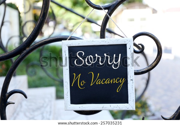 Signboard with text\
Sorry No Vacancy near\
hotel