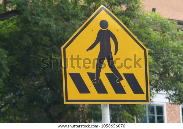 Signboard of zebra\
crossing at pedestrian\
area.