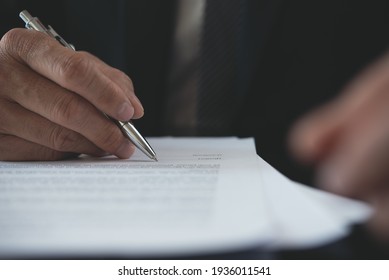 Signing contract, business agreement, deal concept. Businessman signing official contract, formal document, close up. front view. Man manager proofing terms and condition of business document