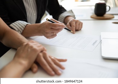 Signing Up Contract. Close Up Of Senior Female Ceo Executive Hand Holding Pen Preparing To Sign Paper Document In Presence Of Business Partner, Elder Woman Lawyer Explaining Client Agreement Details