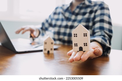 Signing home sales and insurance contracts with real estate agents, signing contracts to know the terms of buying and selling homes and real estate, contract signing ideas. - Shutterstock ID 2253005509