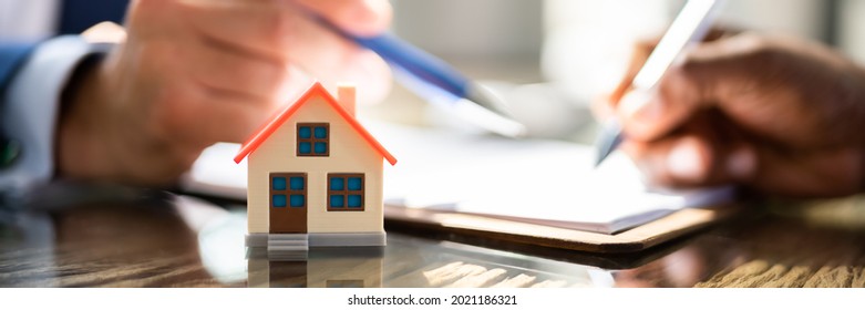 Signing Property Contract Paper. Real Estate Broker - Shutterstock ID 2021186321
