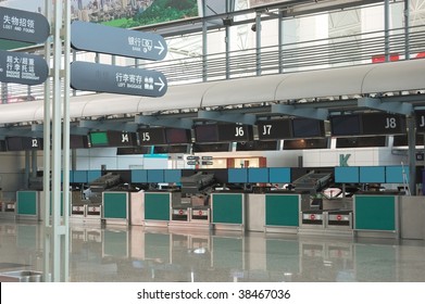 Signpost And Checkin Counter In Airport