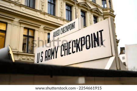 Signpost at Checkpoint Charlie. The crossing point between East and west Berlin, symbol of the Cold War.