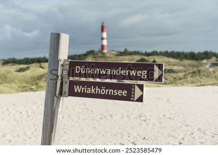 Signpost for a dune hiking trail to a lake called Wriakhörnsee on the island of Amrum