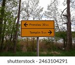 Signpost with the inscription Templin and Prenzlau
