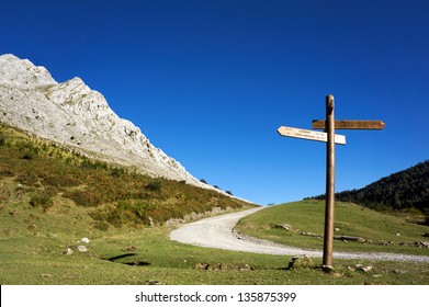 Signpost In The Mountain With Blue Sky