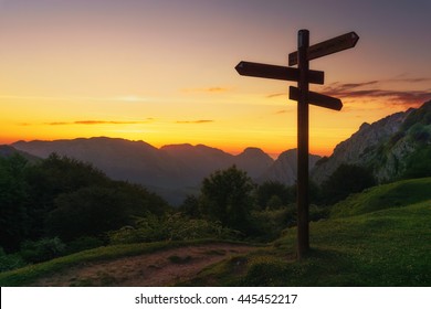 Signpost In The Mountain At The Sunset