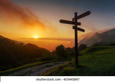 signpost in the mountain at the sunset