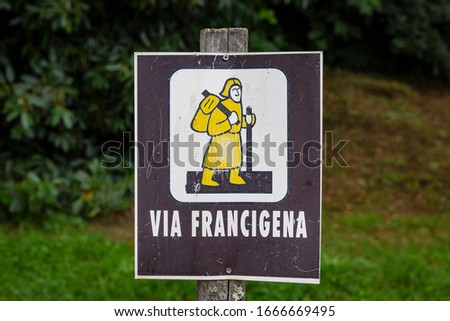 signpost of the Via Francigena (pilgrim's route to Rome) in the countryside