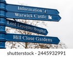 Signposts showing directions to nearby landmarks in the market town of Warwick in Warwickshire, UK.