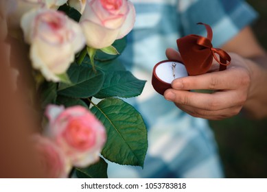 Signs of engagement, ring and flowers - Powered by Shutterstock